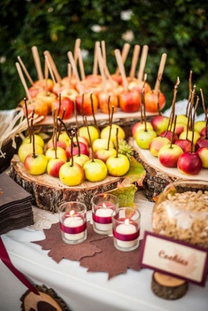 go for apples on sticks, natural and candied ones, they are a perfect treat for any fall wedding