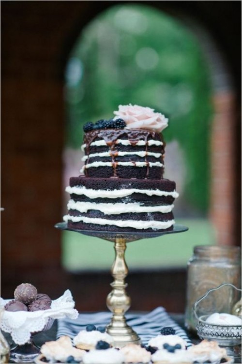 a naked chocolate wedding cake with chocolate drip, blackberries and a blush rose is a decadent and refined idea for a fall wedding