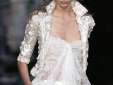 a white lace top with a bow, white pants and a cropped lace applique blazer for a glam and whimsy bridal look