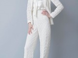 a white boho lace pantsuit with a white silk tank top compose a cool modern boho bridal look