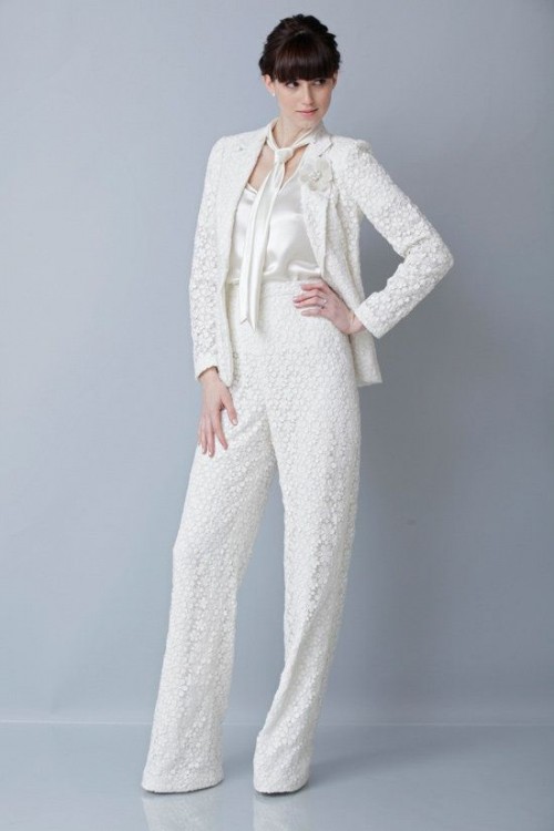 a white boho lace pantsuit with a white silk tank top compose a cool modern boho bridal look