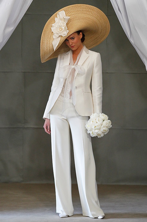 a stylish white pantsuit, a white lace bodysuit, a statement hat and white heels for an elegant look
