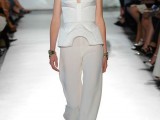 an haute couture bridal look with white palazzo pants, a strapless sculptural top with patterns and white shoes