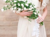 a beautiful and trendy white long stem wedding bouquet is a cool idea for a spring or summer bride, it will add a touch of trend to the look
