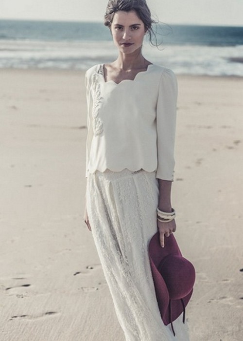 a casual yet chic bridal separate with a plain top with embroidery and a scallop edge, a lace maxi skirt and a burgundy hat is a lovely outfit for a casual beach wedding