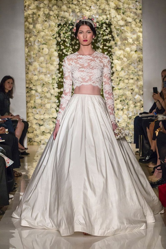 A luxurious bridal separate with a lace crop top with long sleeves and a full plain skirt with subtle pleating for a royal like look