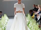 an ultra-modern bridal separate with a crop top that features a creative edge, short sleeves and a high neckline and a full skirt with pockets