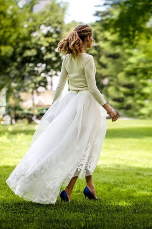 a neutral long-sleeve top and a lace maxi skirt plus blue shoes for a stylish and casual bridal look