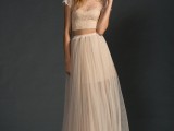 a romantic and lovely blush bridal separate with a crop top with an illusion neckline and short sleeves and a maxi skirt with a short underskirt is beautiful