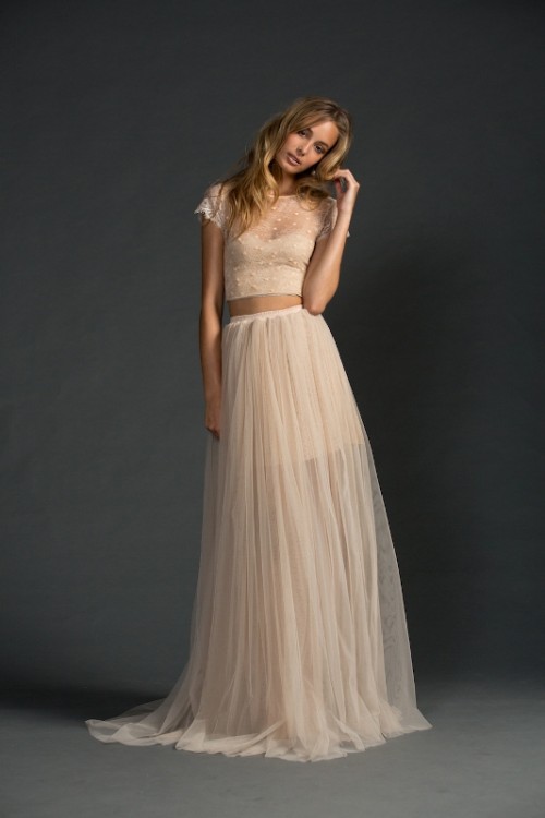 a romantic and lovely blush bridal separate with a crop top with an illusion neckline and short sleeves and a maxi skirt with a short underskirt is beautiful