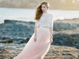 a white lace crop top with a high neckline and short sleeves, a pink flowy maxi skirt for a romantic and airy bridal look
