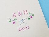 a bold wedding invitation with colorful embroidery – monograms, decor and a date is a cute thing that you can DIY