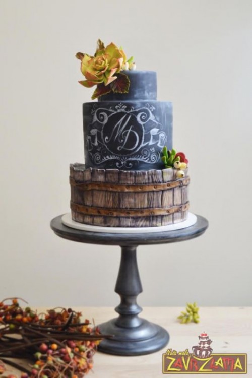 a chalkboard wedding cake with personalized chalking, a creative wood-inspired tier, sugar blooms and succulents is gorgeous for a wedding