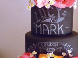 a chalkboard wedding cake with orange tiers, with chalk detailing and bold blooms is a gorgeous idea for a modern wedding