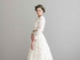 a romantic lace two-piece wedding dress with a crop top with long sleeves and a high low skirt with a train is a chic idea