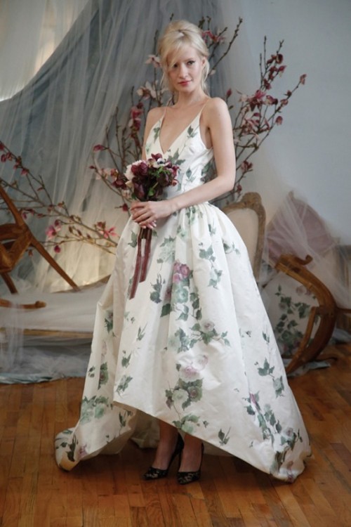 a fantastic floral print wedding ballgown with a spaghetti strap bodice and a deep V-neckline, with a high low skirt and black lace shoes for a refined look