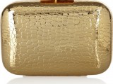 a shiny gold clutch with crocodile leather print is a chic and cool idea for a modenr bride, it will give you a bold and cool look