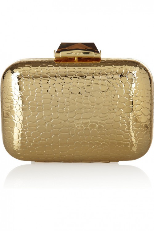 a shiny gold clutch with crocodile leather print is a chic and cool idea for a modenr bride, it will give you a bold and cool look