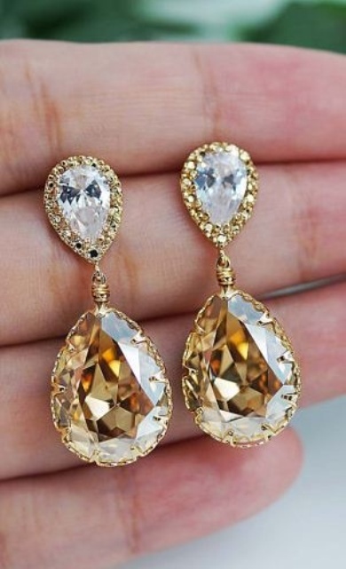 beautiful and chic gold statement bridal earrings with white and yellow crystals will finish off your look in a refined way