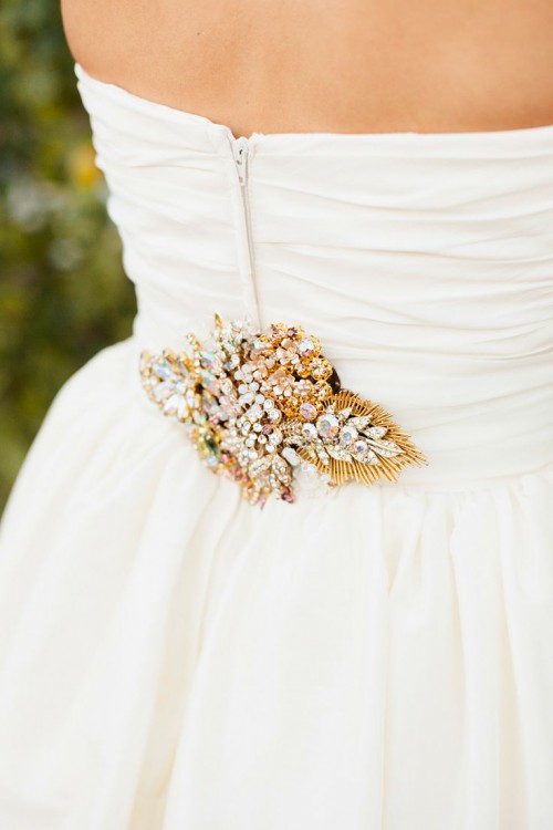 a sash with an oversized gold leaf done with crystals of various kinds is a fantastic idea for a vintage glam bride