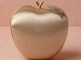 a lovely gold apple clutch with crystals and beading is a unique solution for a bride, you may carry anything you need in it
