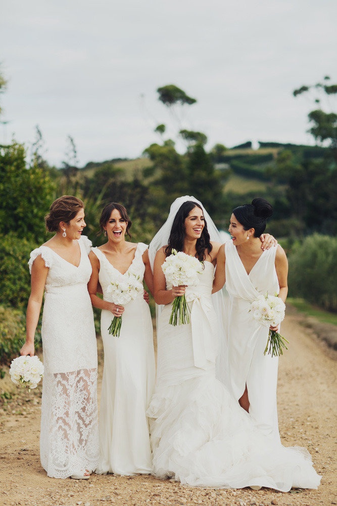 Mismatching white V neckline bridesmaid dresses will let each girl show off her personal style