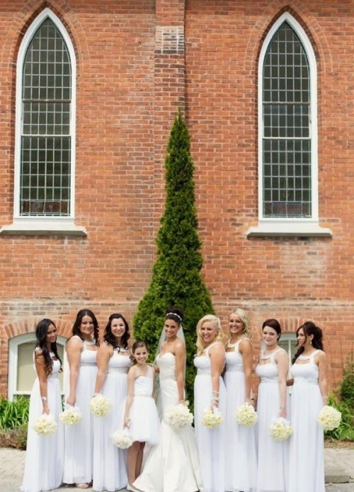 matching white maxi bridesmaid dresses with cutout necklines are amazing for rocking them in spring or summer