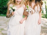 matching white A-line bridesmaid dresses with empire waist, with V-necklines and straps are amazing for a spring or summer wedding