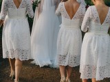 classy white lace midi bridesmaid dresses with V cutout backs and nude shoes are amazing for a vintage neutral wedding