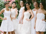mismatching white plain, lace and pleated bridesmaid dresses for a modern tropical wedding