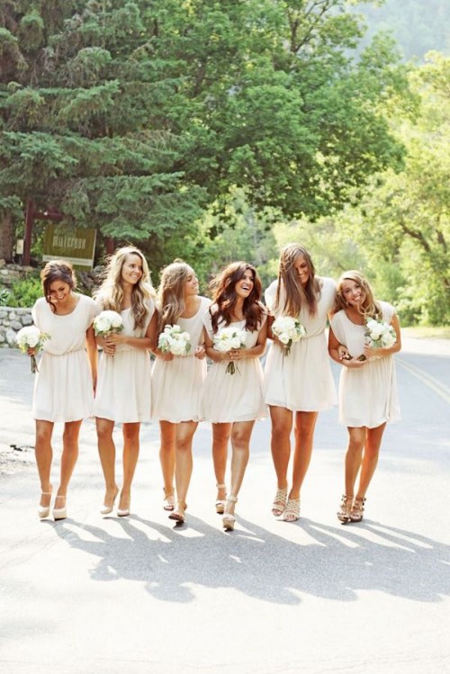 neutral mini bridesmaid dresses with short sleeves and scoop necklines plus nude shoes are great for a spring or summer wedding