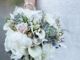 a neutral wedding bouquet of roses and callas, some grass fillers and succulents is perfect for a neutral wedding