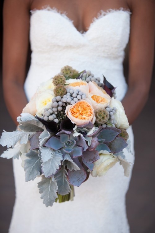 a neutral wedding bouquet of peachy and white blooms, dark foliage and dark succulents, berries, pale leaves and seed pods will be a nice idea for a winter wedding