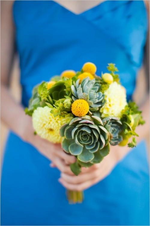 a bold wedding bouquet of white blooms, billy balls and succulents is a cool and bright spring or summer idea for a bride or a bridesmaid