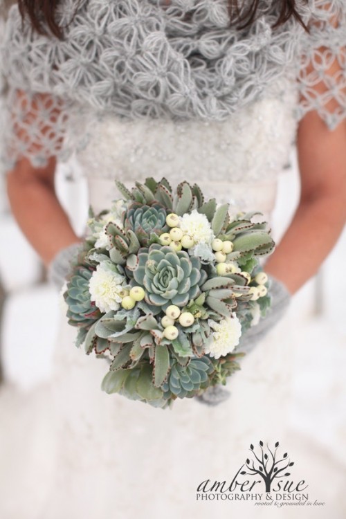 a white wedding bouquet with succulents and berries is a lovely idea for a rustic bride
