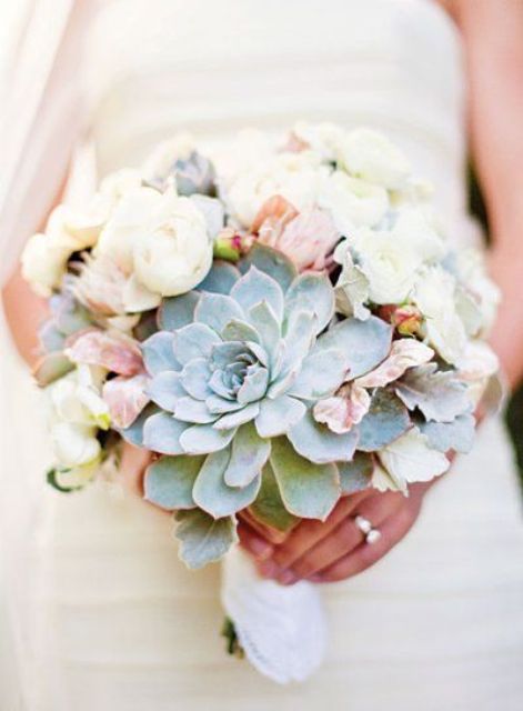 a pastel wedding bouquet accented with a large succulent is a bold and cool idea for a spring or summer bride