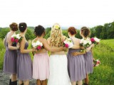 mismatching short grey bridesmaid dresses and a light pink one for the maid of honor
