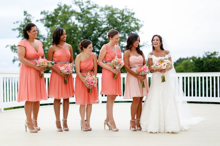 Mismatching coral pink knee dresses for the gals and a blush strapless gown for the maid of honor
