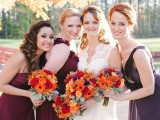 mismatching burgundy dresses for the bridesmaids and a purple gown for the maid of honor