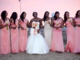 matching pink maxi gowns for the bridesmaids and a neutral lace gown for the maid of honor