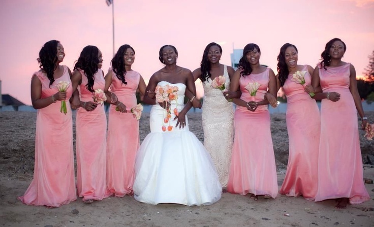 Matching pink maxi gowns for the bridesmaids and a neutral lace gown for the maid of honor