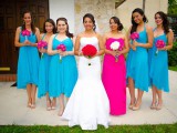 matching bold blue high low bridesmaid dresses and a hot pink strapless maxi dress