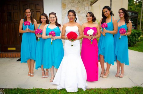 matching bold blue high low bridesmaid dresses and a hot pink strapless maxi dress