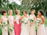 mismatching blush bridesmaid dresses and a one shoulder coral pink maxi gown for the maid of honor
