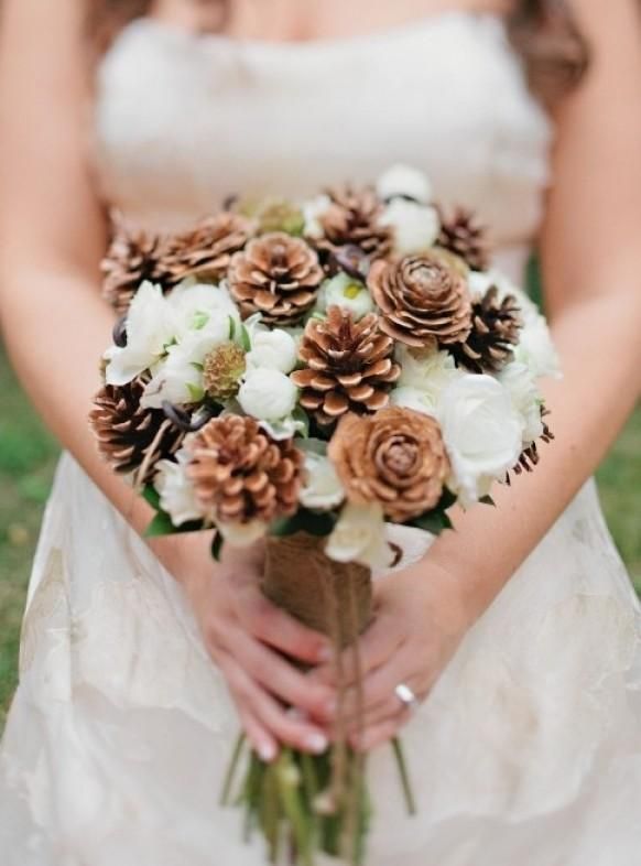A pretty and cozy winter wedding bouquets of white blooms and pinecones is a cool idea for a rustic winter wedding