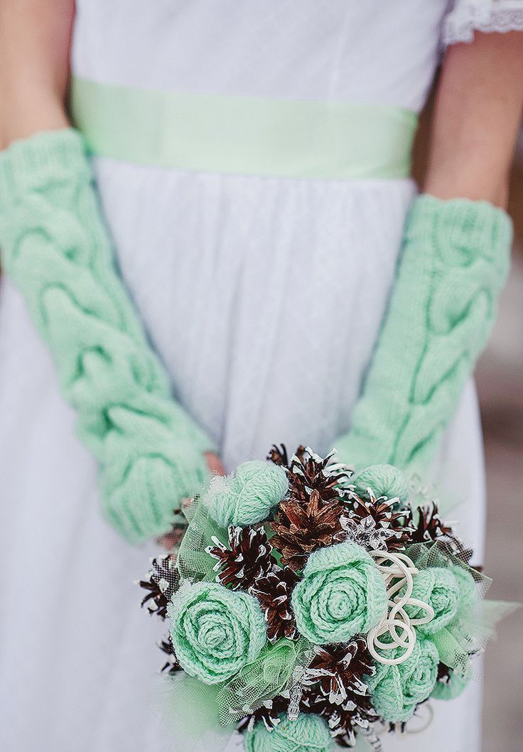 A beautiful winter wedding bouquet of pinecones and green crochet flowers is a lovely and cozy winter wedding idea to rock