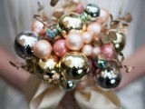 a beautiful winter wedding bouquet made of pastel and metallic ornaments of various sizes and of gilded leaves is a lovely idea for a winter bride