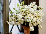 a cute white berry wedding bouquet with a copper wrap is a gorgeous idea for a rustic or just relaxed winter wedding
