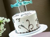 funny and cute turquoise fish cake toppers with little hearts are fantastic for a beach or coastal wedding