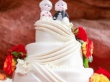 little doll cake toppers are a funny and cool idea to top your wedding cake and to make it creative and bold